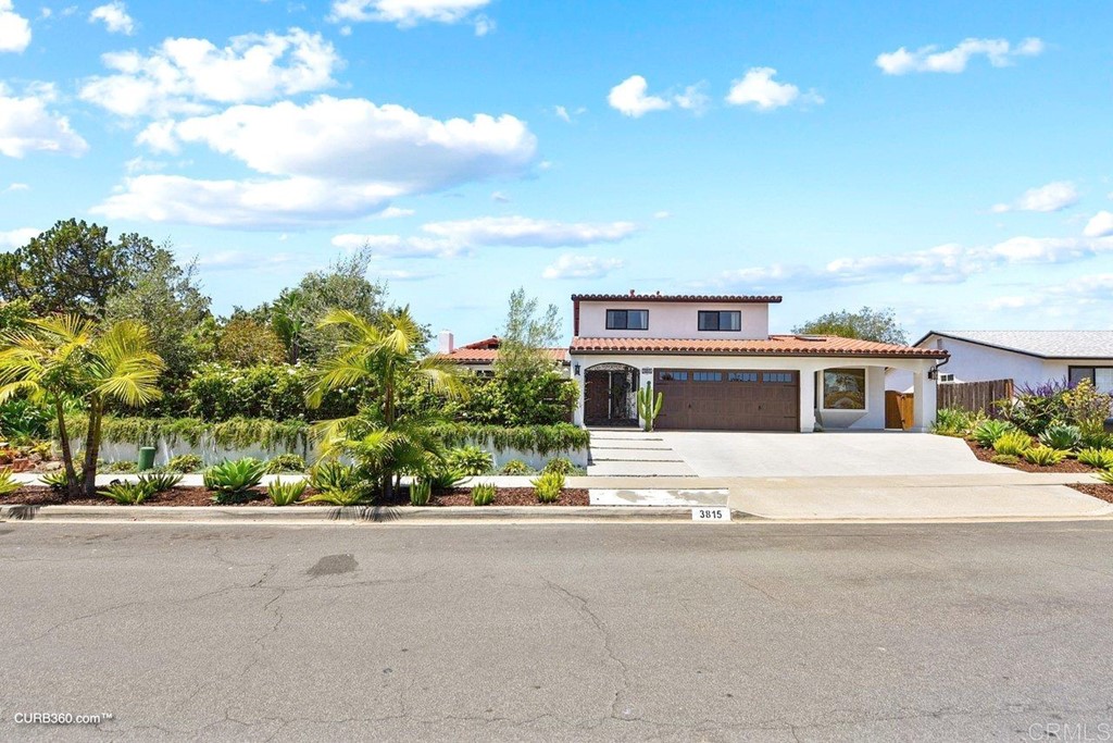 3815 Trieste Drive Carlsbad, CA 92010 - Photo 24 of 24 a house with a yard and a car park in front of it