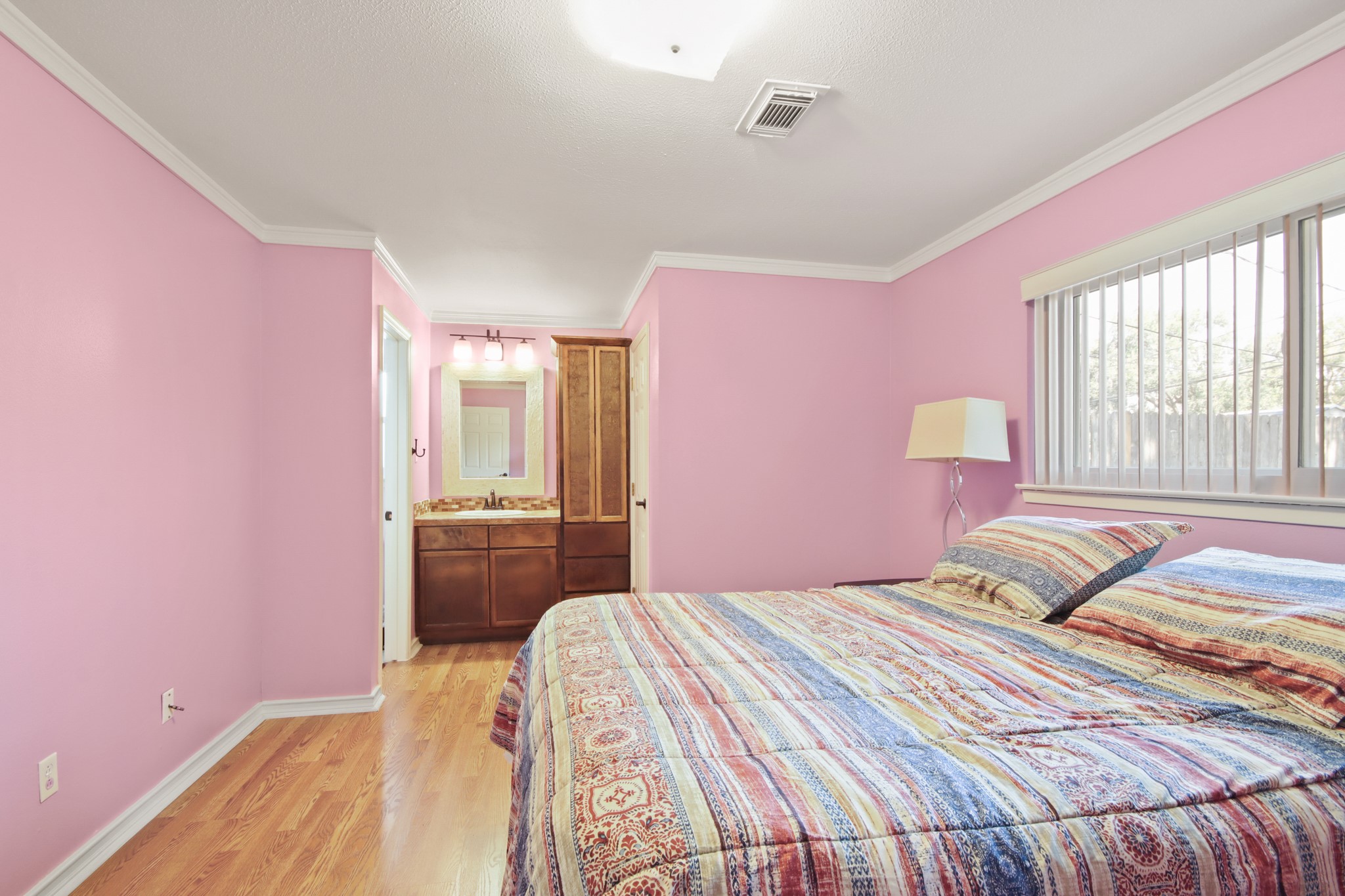 14923 Lofton Street Channelview, TX 77530 - Photo 12 of 25 a bedroom with a bed and a couch