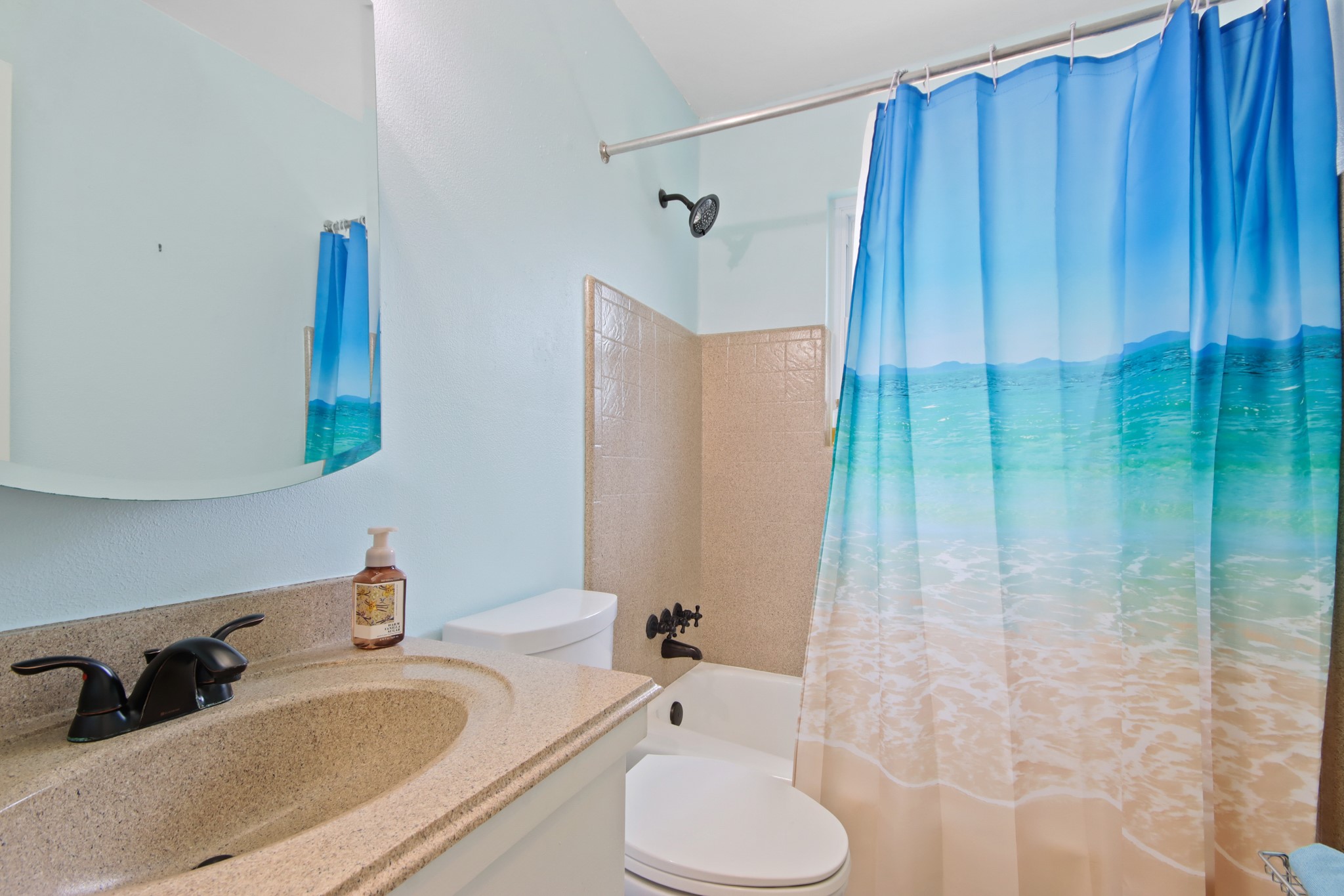 14923 Lofton Street Channelview, TX 77530 - Photo 16 of 25 a bathroom with a sink and a mirror