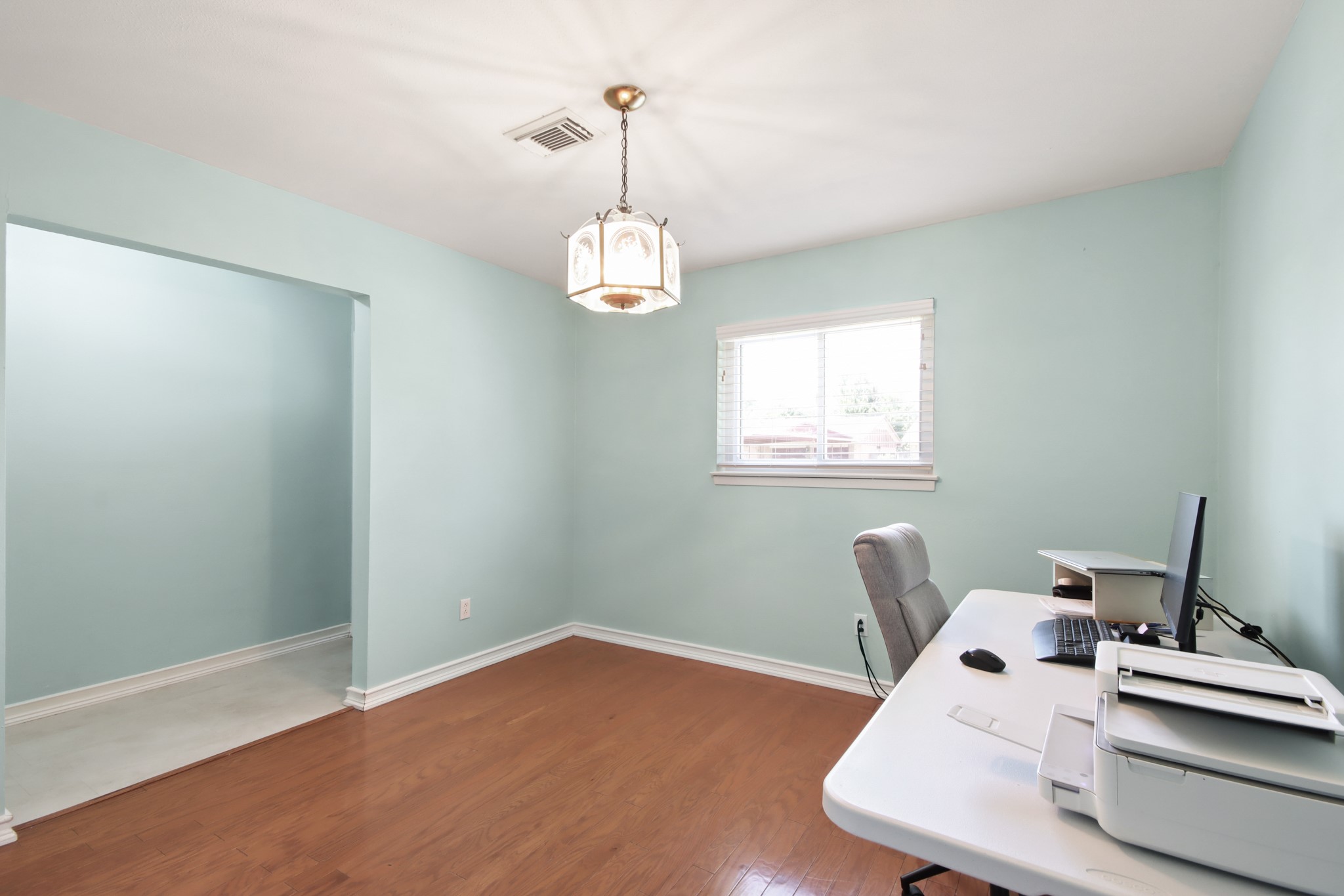 14923 Lofton Street Channelview, TX 77530 - Photo 17 of 25 a workspace with furniture and window