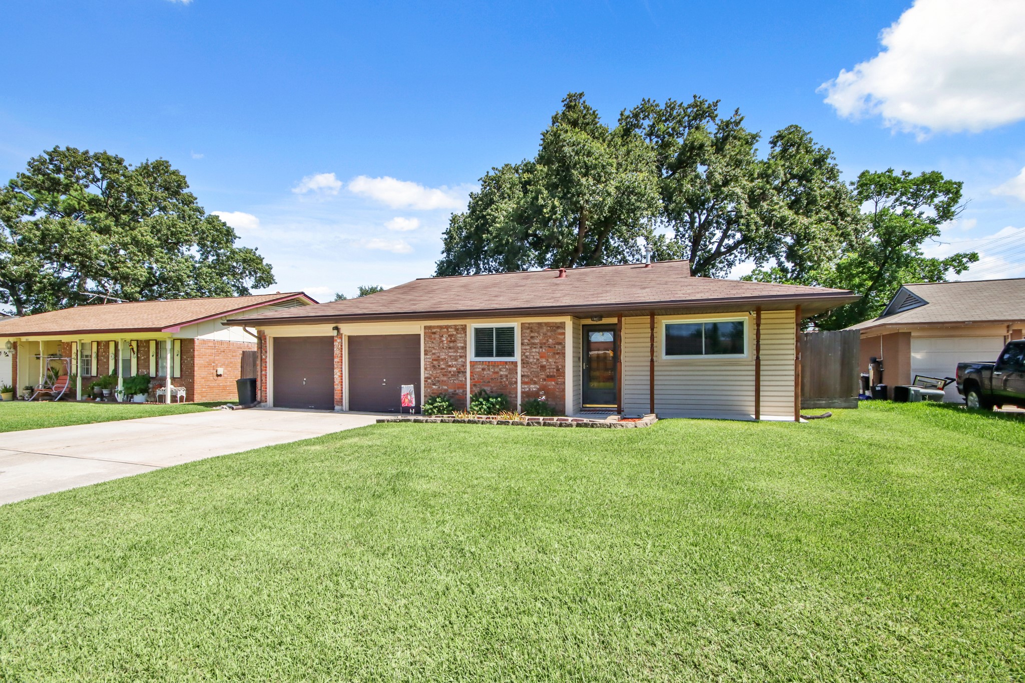 14923 Lofton Street Channelview, TX 77530 - Photo 2 of 25 a front view of a house with a garden