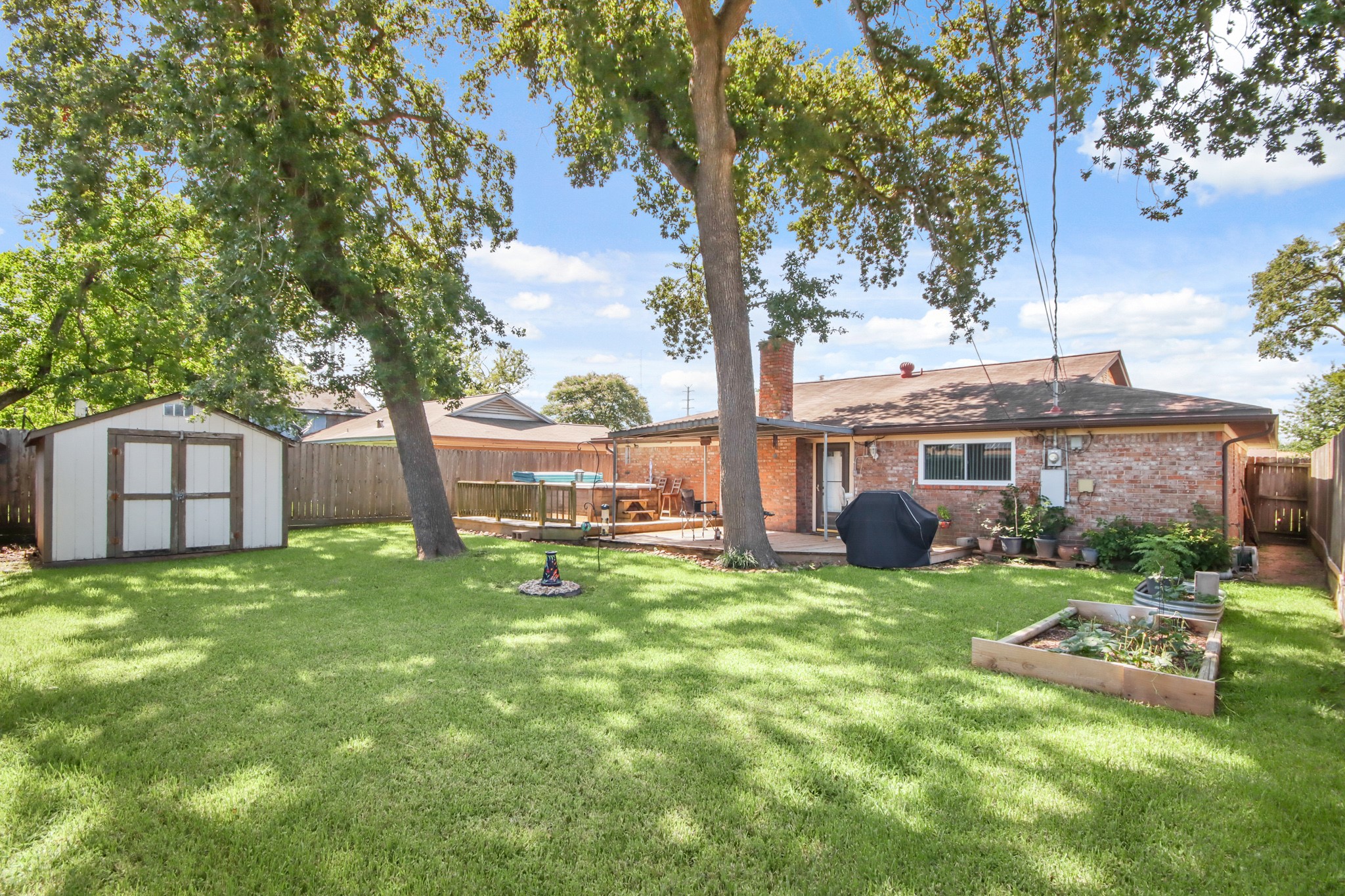 14923 Lofton Street Channelview, TX 77530 - Photo 24 of 25 a view of a house with a yard