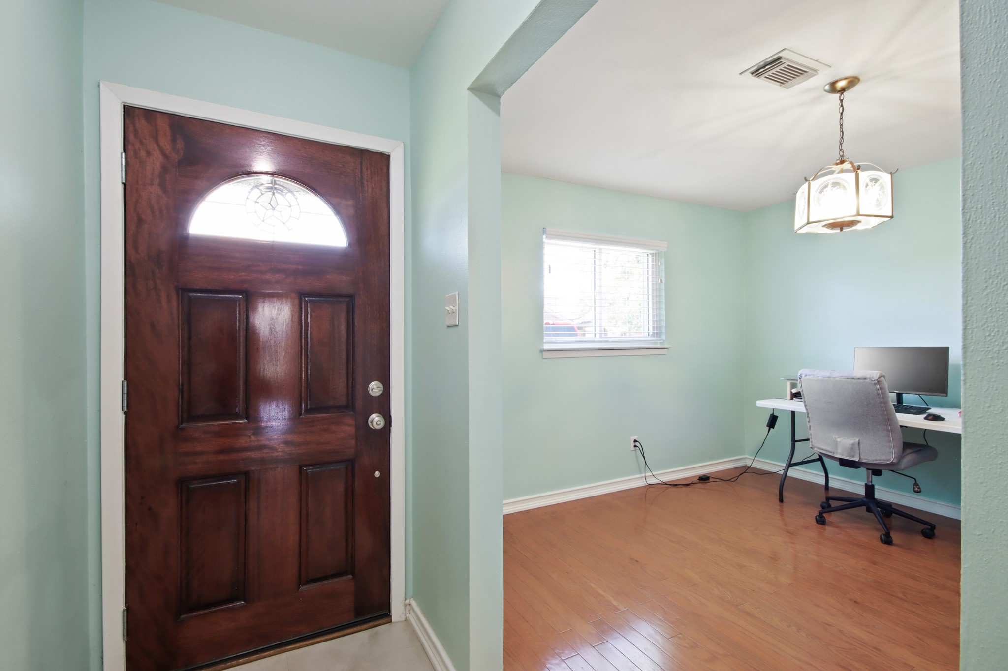 14923 Lofton Street Channelview, TX 77530 - Photo 4 of 25 a room that has a window and a mirror