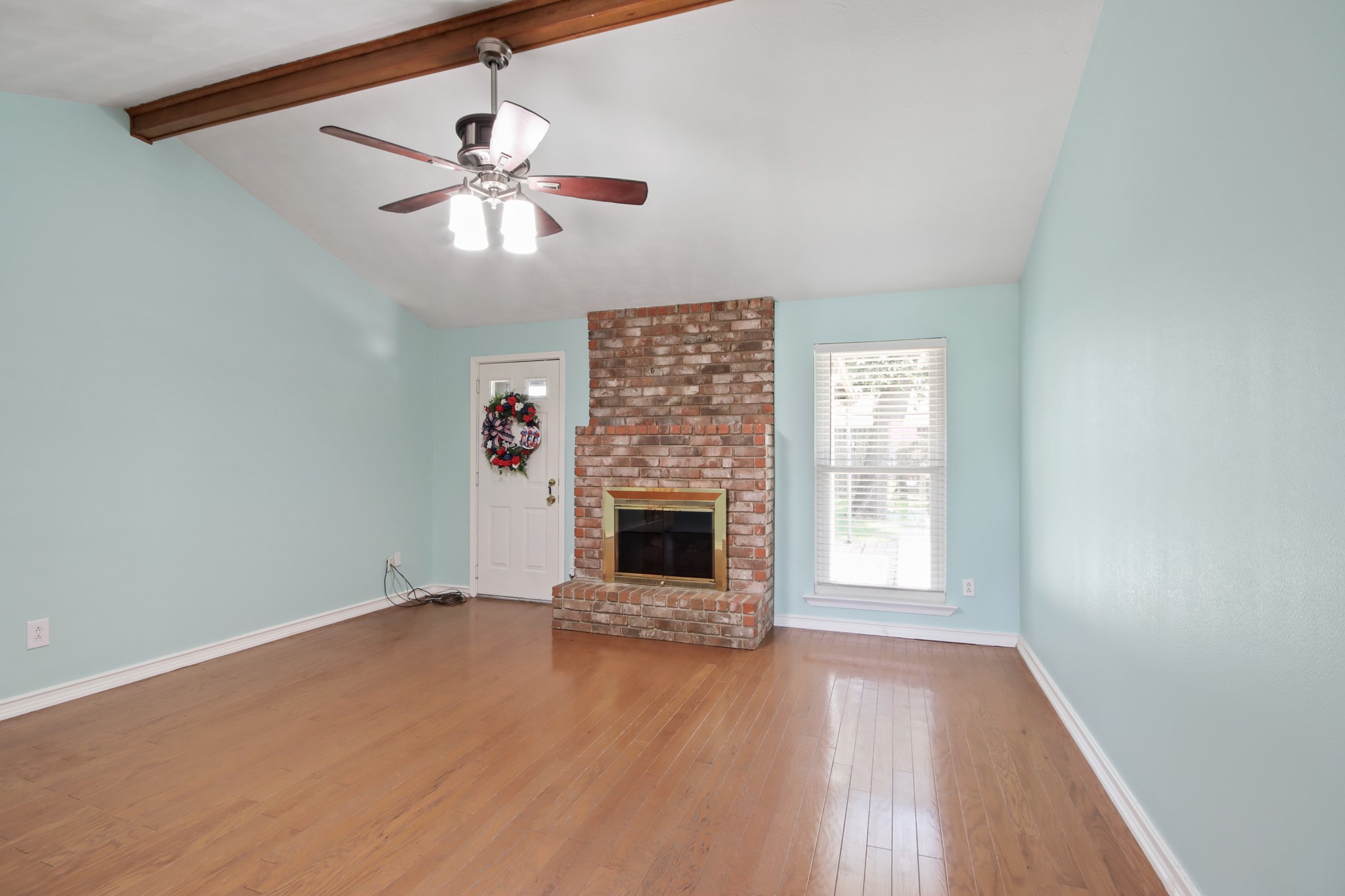 14923 Lofton Street Channelview, TX 77530 - Photo 5 of 25 an empty room with windows and fireplace