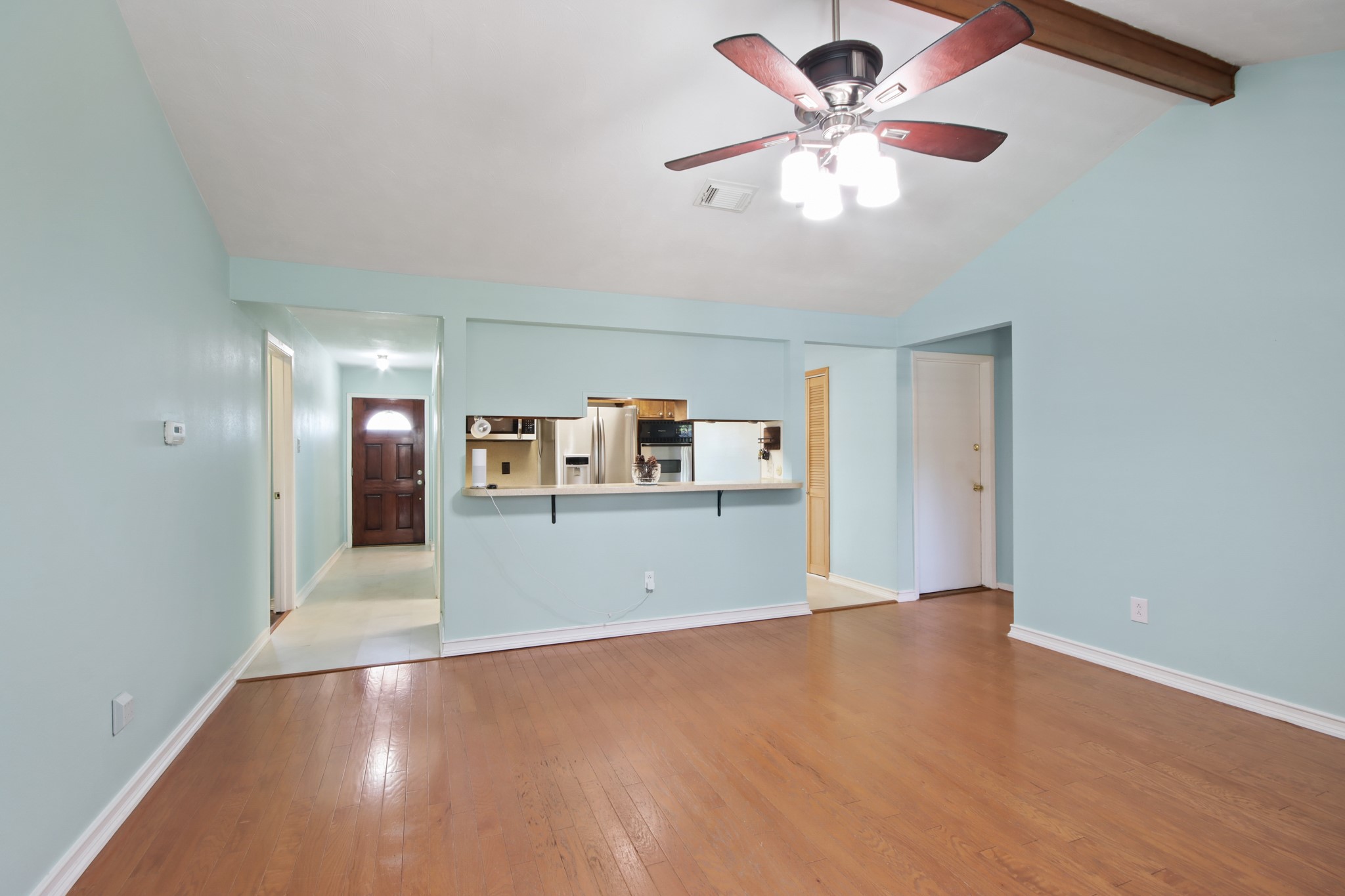 14923 Lofton Street Channelview, TX 77530 - Photo 6 of 25 a view of a livingroom with a window and a kitchen