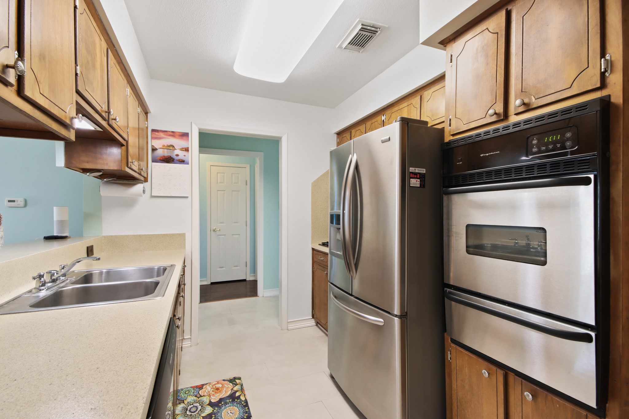 14923 Lofton Street Channelview, TX 77530 - Photo 9 of 25 a kitchen with stainless steel appliances granite countertop a refrigerator a sink and dishwasher