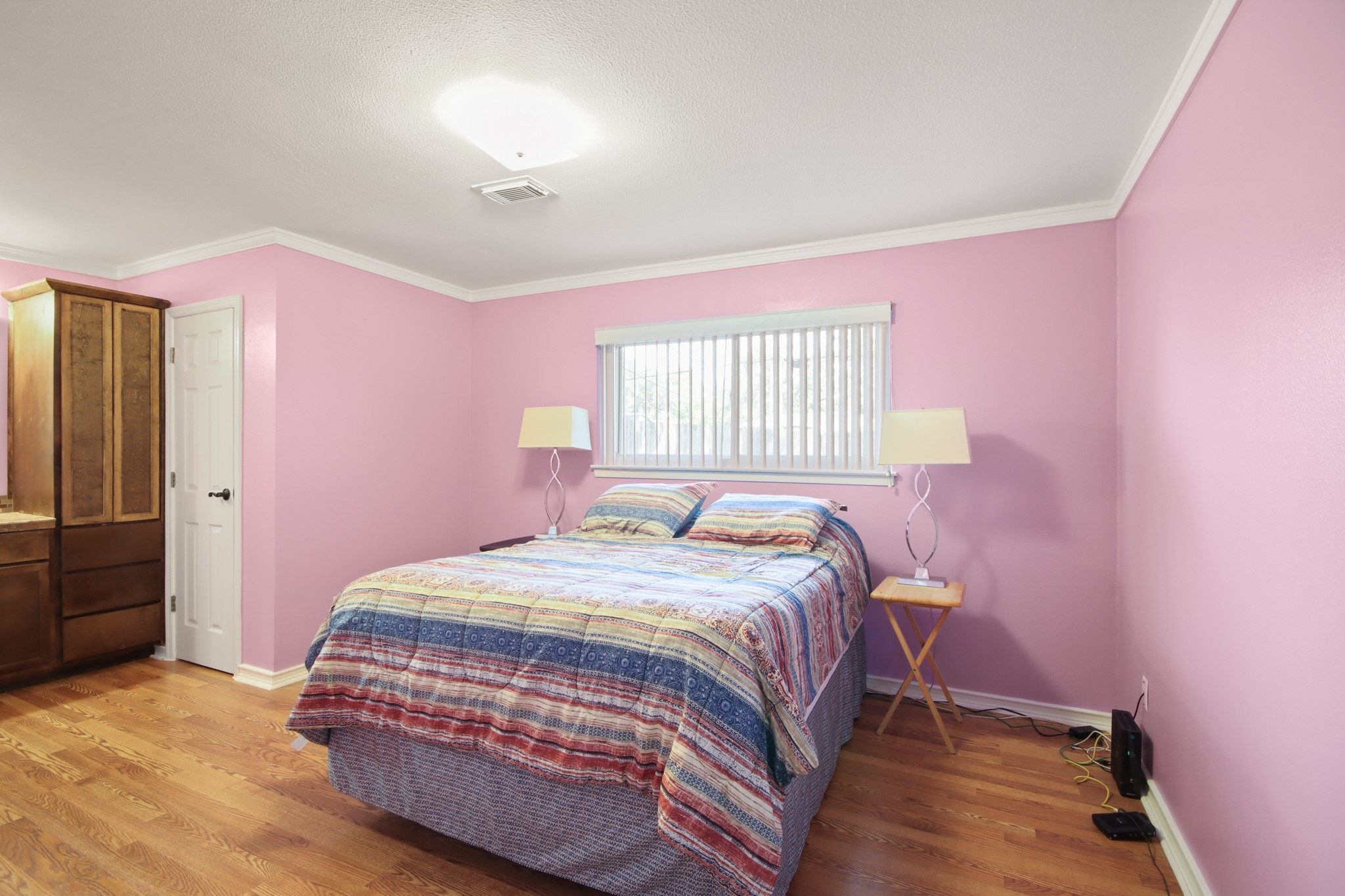 14923 Lofton Street Channelview, TX 77530 - Photo 10 of 25 a bedroom with a bed and a window