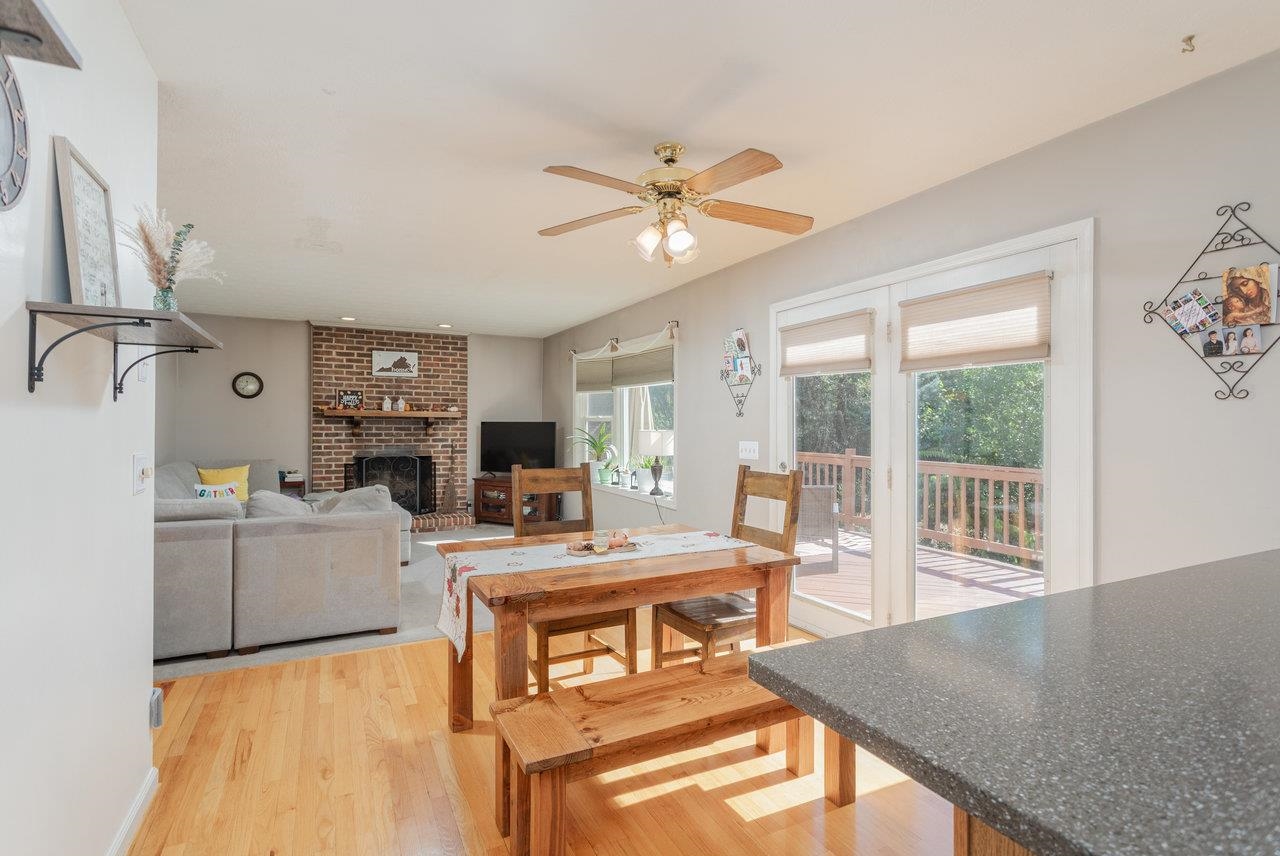 1480 Bluewater Road Harrisonburg, VA 22801 - Photo 12 of 46 a living room with furniture a flat screen tv and a floor to ceiling window