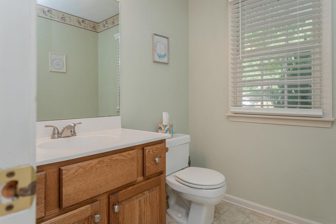 1480 Bluewater Road Harrisonburg, VA 22801 - Photo 16 of 46 a bathroom with a sink a toilet and a mirror