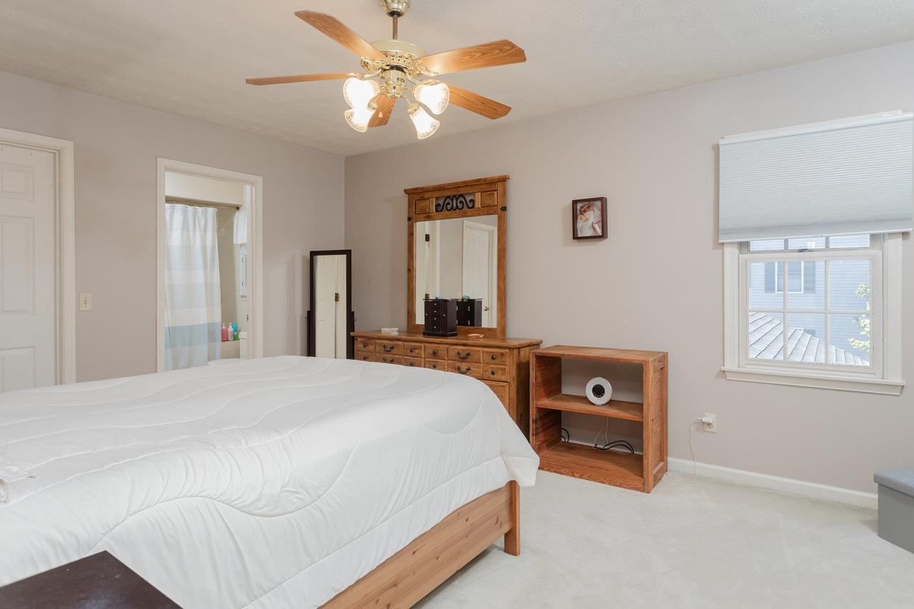 1480 Bluewater Road Harrisonburg, VA 22801 - Photo 23 of 46 a bedroom with a bed and a chandelier