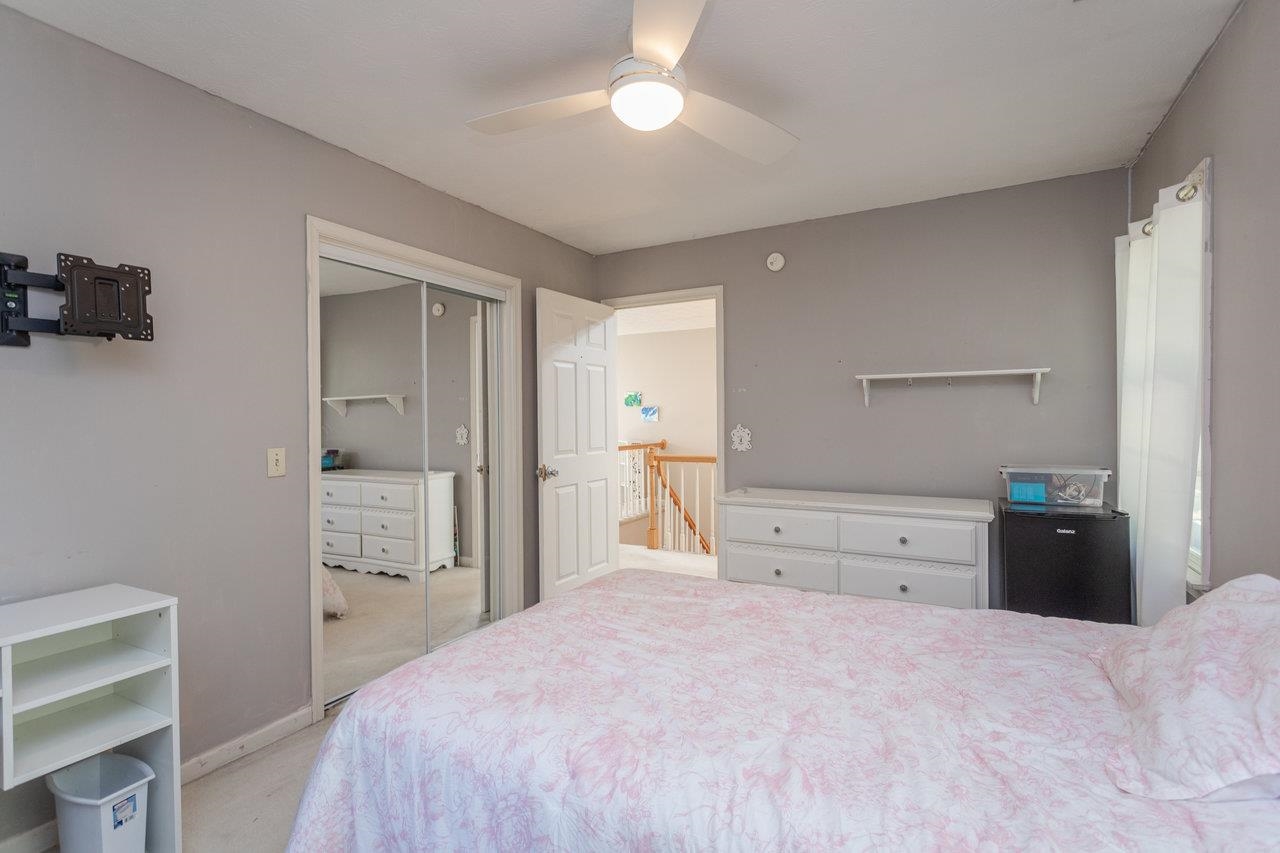 1480 Bluewater Road Harrisonburg, VA 22801 - Photo 27 of 46 a bedroom with a bed and a chandelier