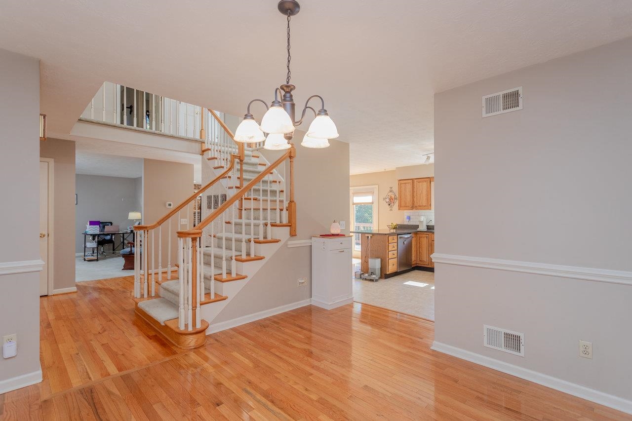 1480 Bluewater Road Harrisonburg, VA 22801 - Photo 6 of 46 a view of entryway and hall with wooden floor