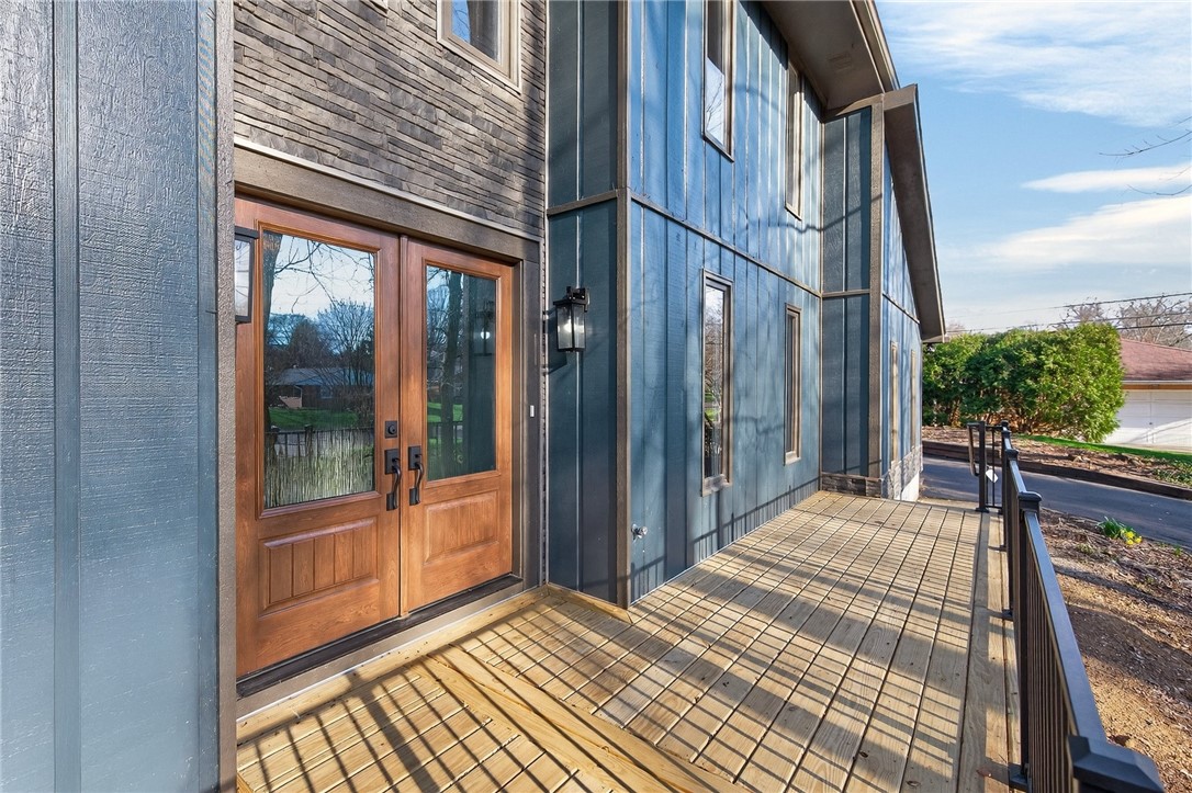4747 Fawnwood Road Dayton, OH 45429 - Photo 5 of 58 This residence features a charming entryway with wood doors, leading to a spacious deck.