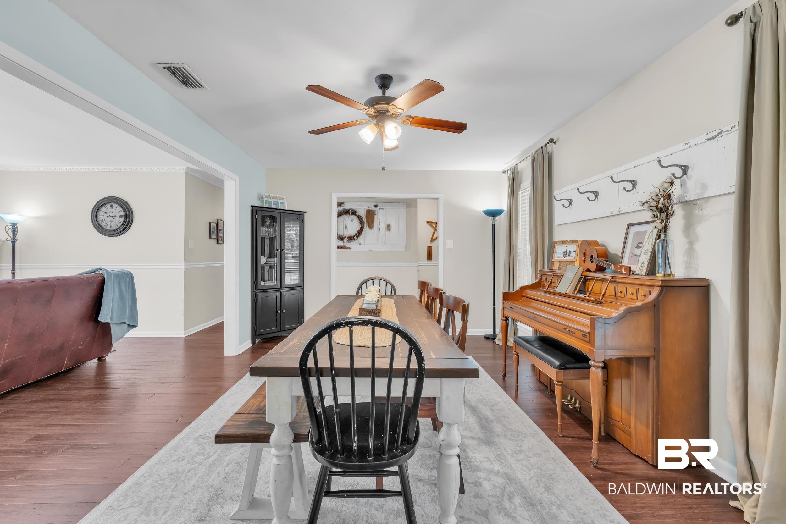 224 Cache Circle Mobile, AL 36611 - Photo 18 of 42 Dining room featuring ceiling fan, dark wood-style flooring, and baseboards