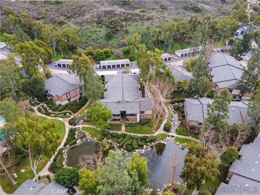 20702 El Toro Road, Unit 258 Lake Forest, CA 92630 - Photo 1 of 30 an aerial view of a house with a garden and lake view