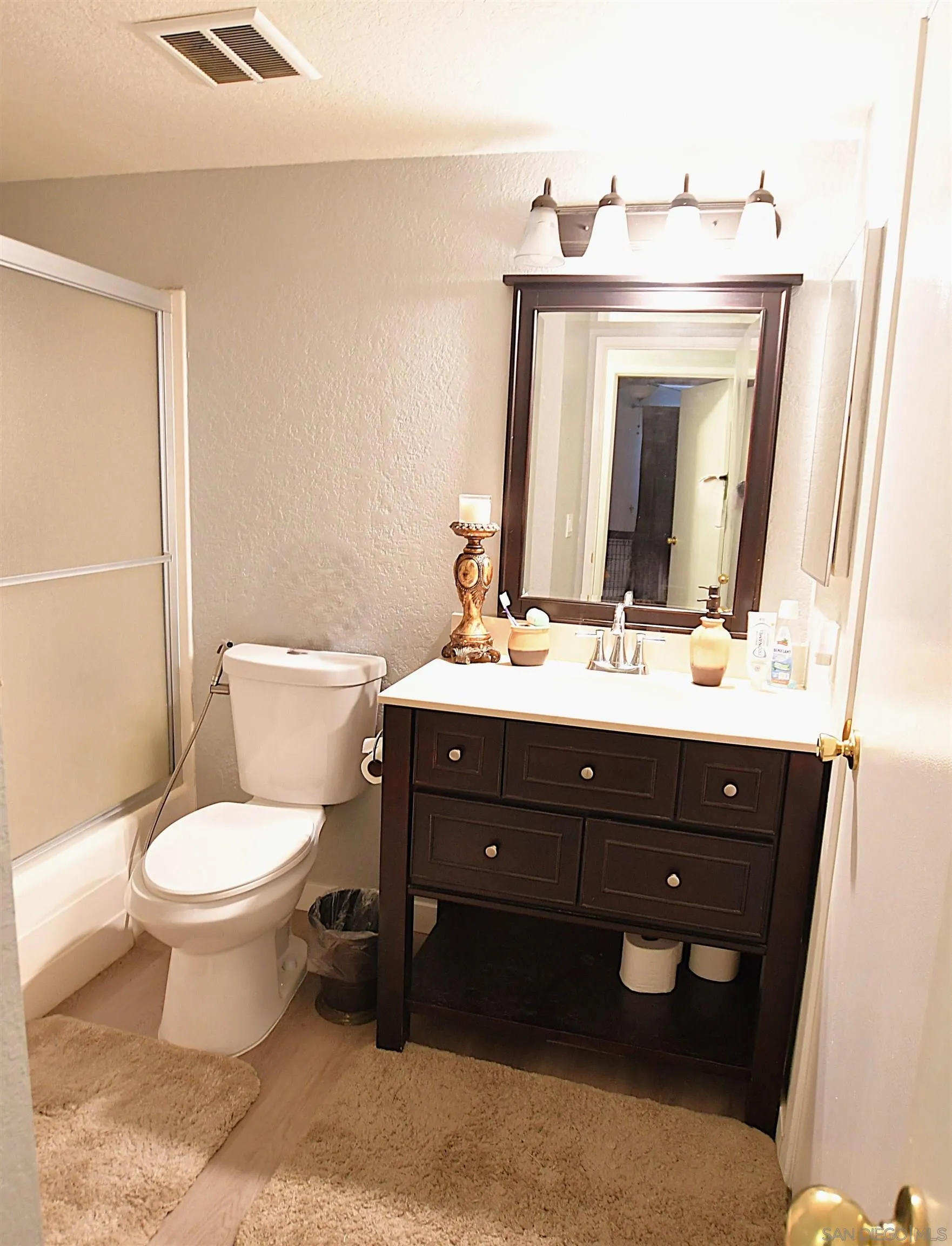 20702 El Toro Road, Unit 258 Lake Forest, CA 92630 - Photo 12 of 30 a bathroom with a toilet sink and mirror
