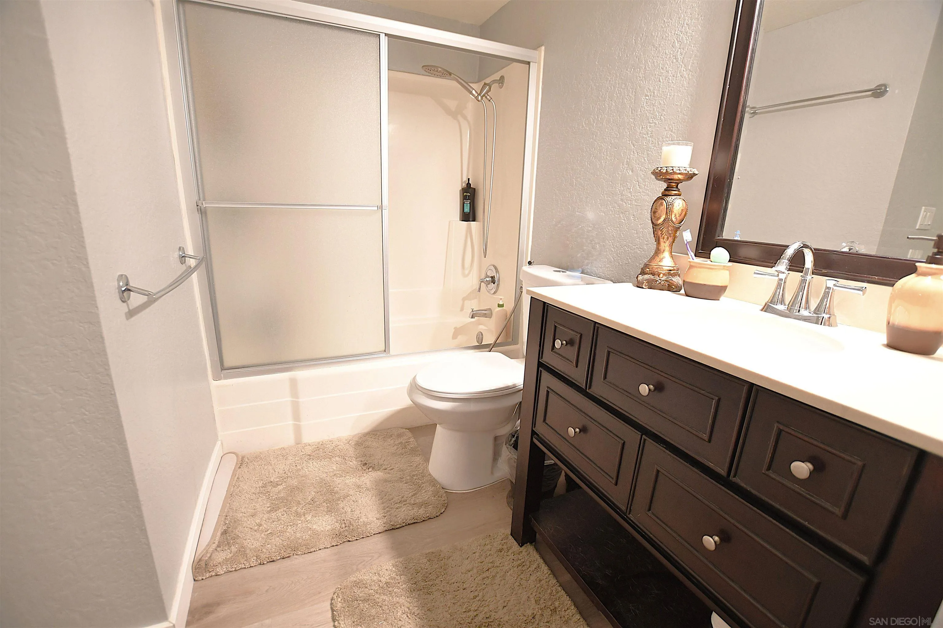 20702 El Toro Road, Unit 258 Lake Forest, CA 92630 - Photo 13 of 30 a bathroom with a sink a toilet and a mirror