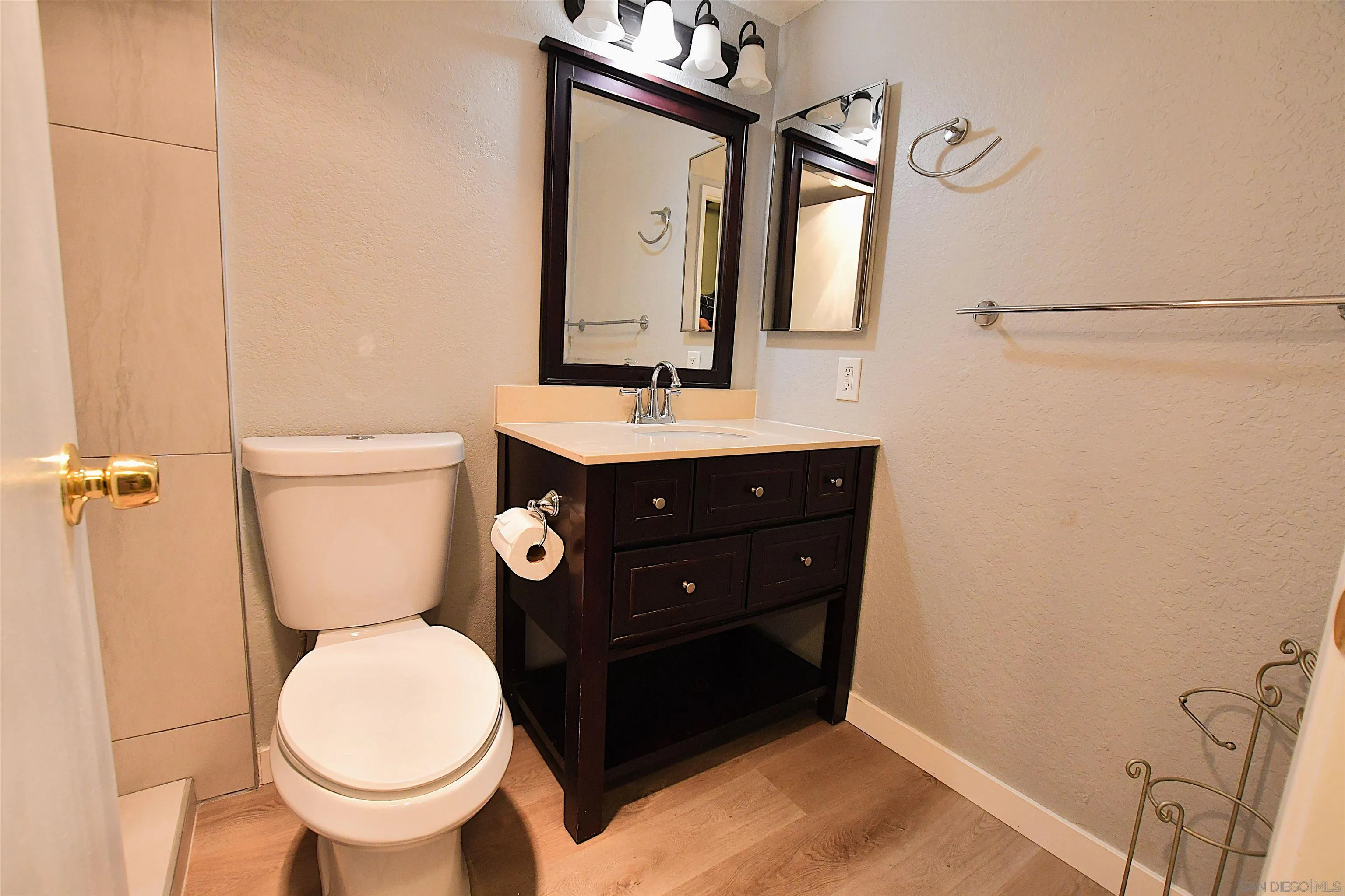 20702 El Toro Road, Unit 258 Lake Forest, CA 92630 - Photo 16 of 30 a bathroom with a toilet sink and mirror