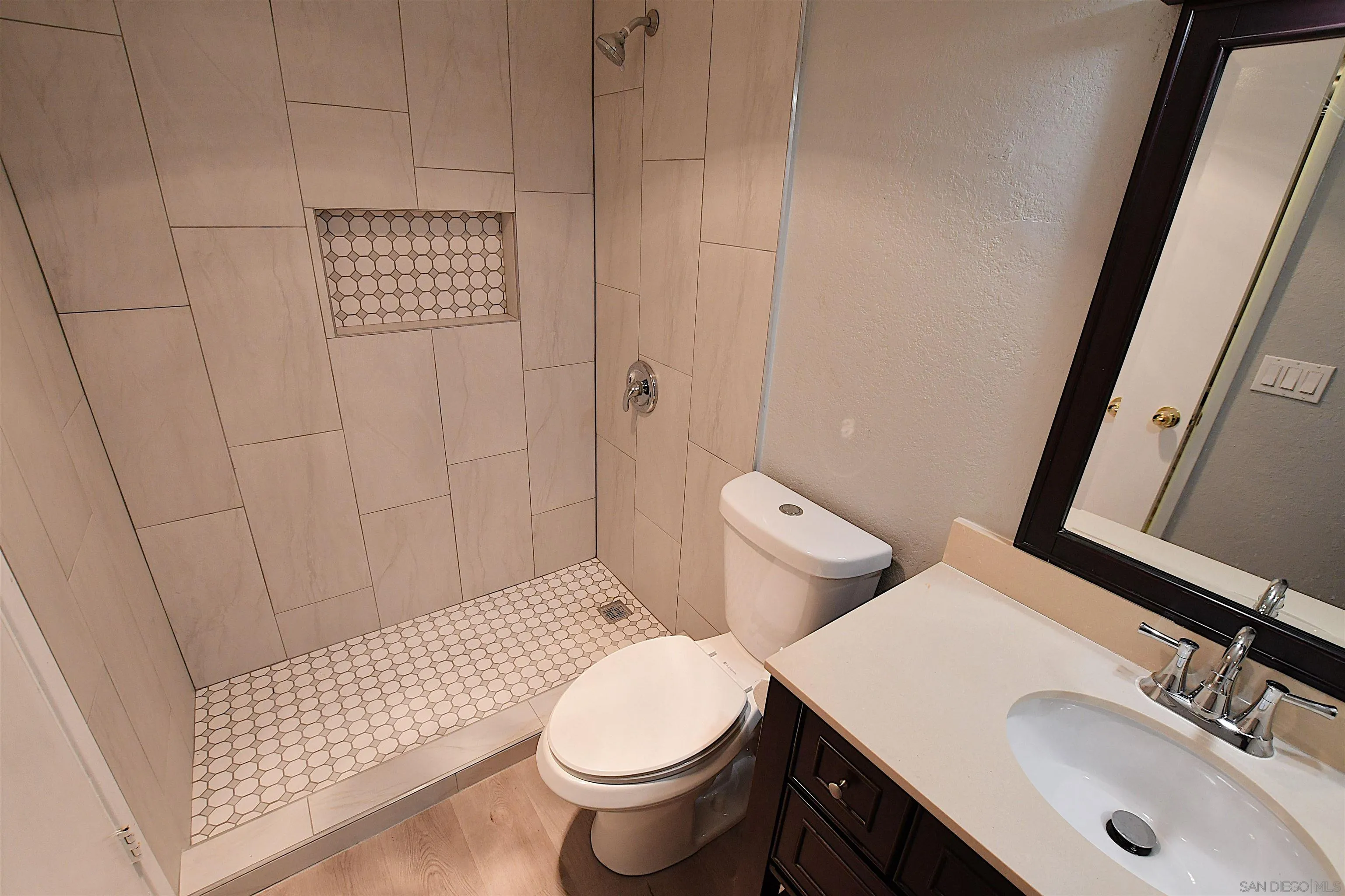 20702 El Toro Road, Unit 258 Lake Forest, CA 92630 - Photo 17 of 30 a bathroom with a sink toilet and shower