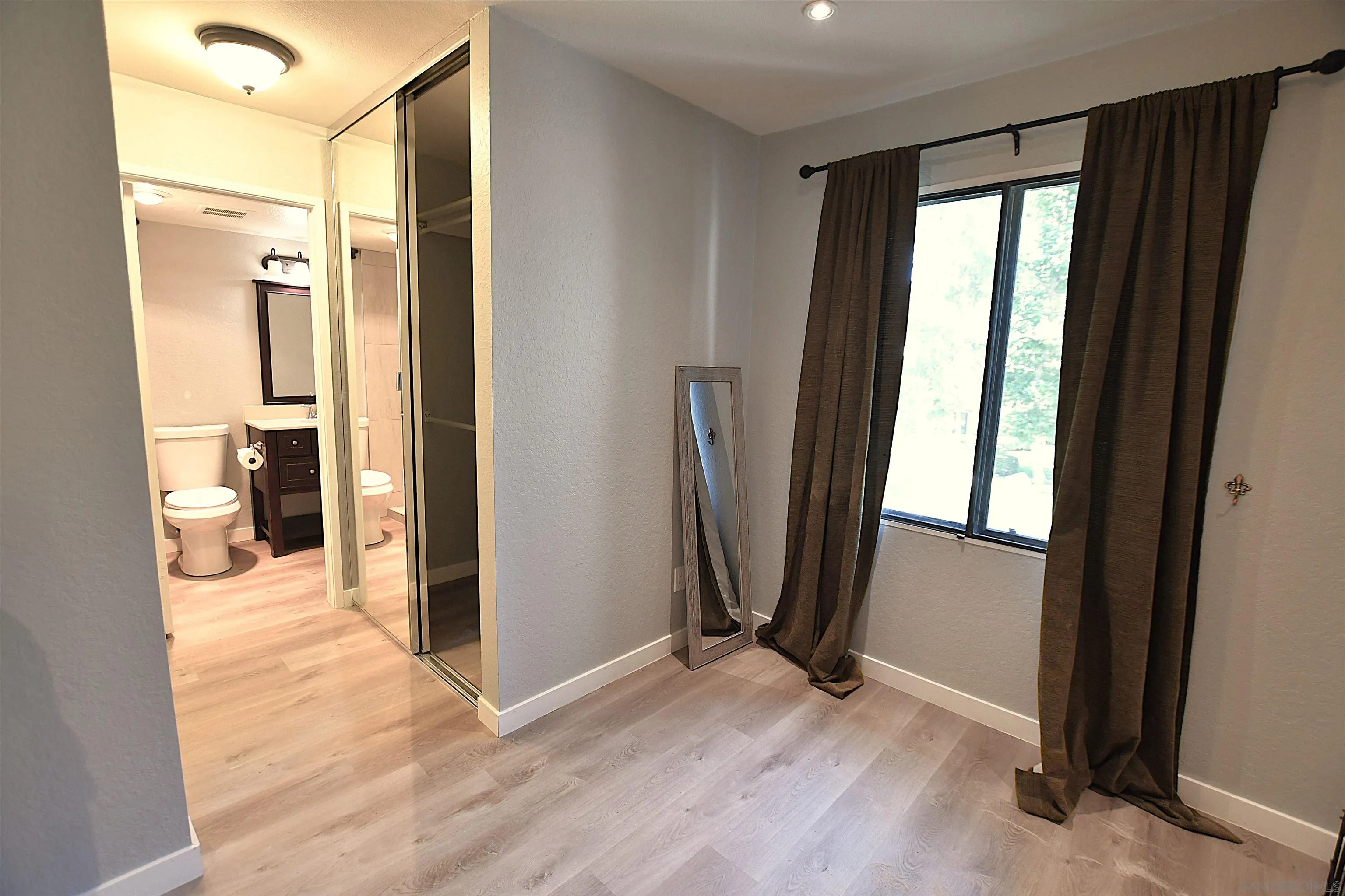 20702 El Toro Road, Unit 258 Lake Forest, CA 92630 - Photo 19 of 30 a view of a bathroom with a glass door and shower