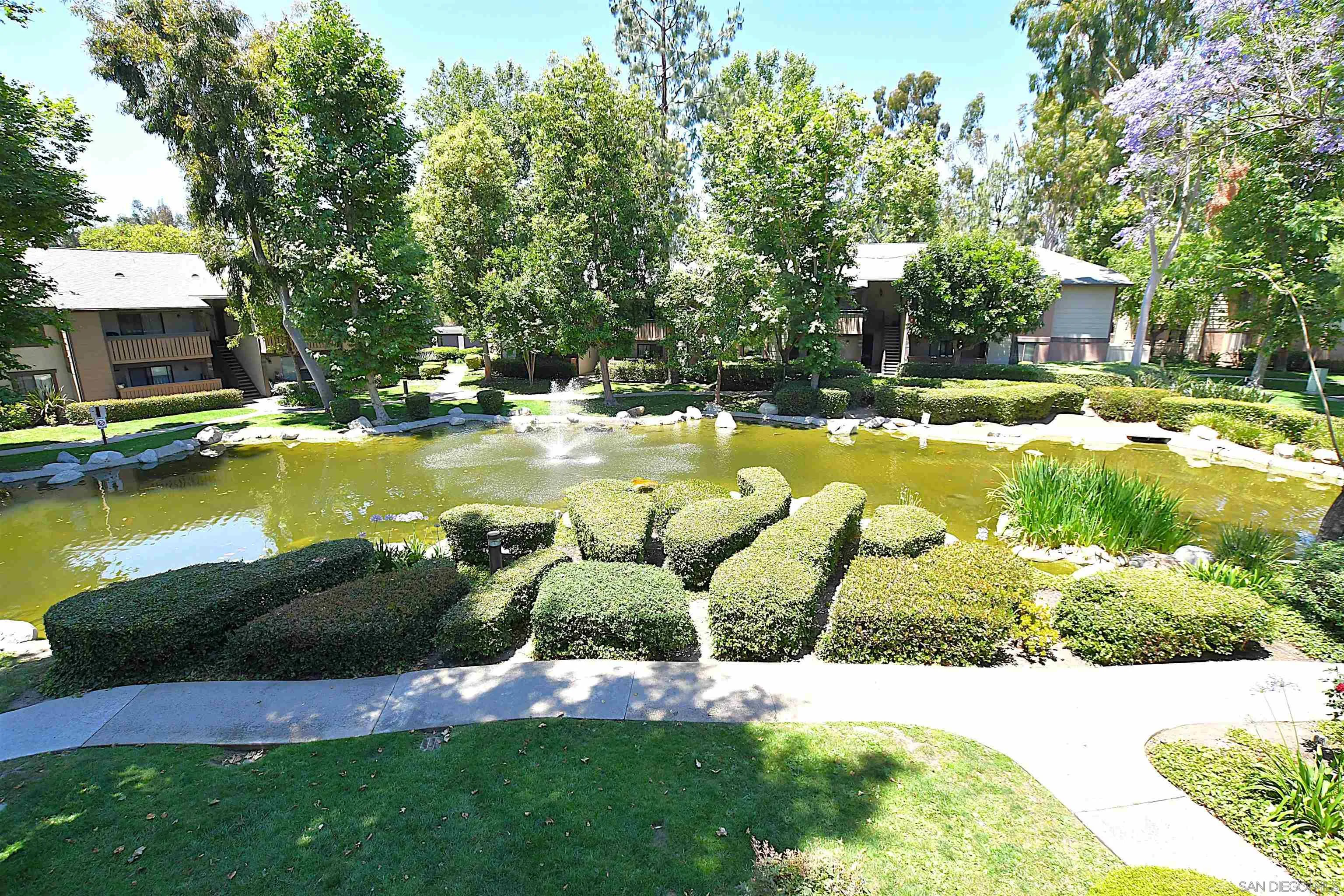 20702 El Toro Road, Unit 258 Lake Forest, CA 92630 - Photo 23 of 30 a view of a swimming pool with a garden