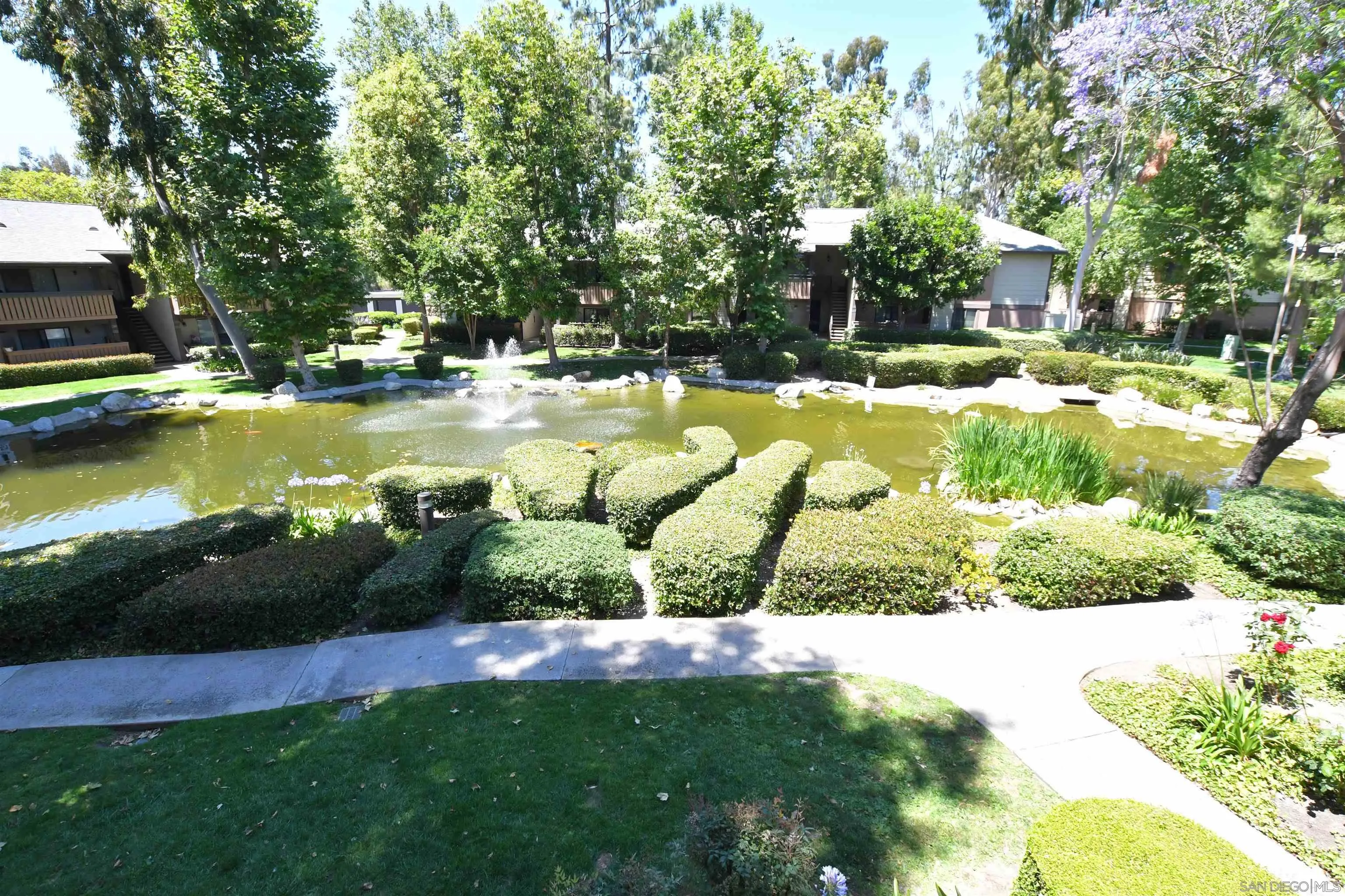 20702 El Toro Road, Unit 258 Lake Forest, CA 92630 - Photo 24 of 30 a view of a swimming pool and a yard