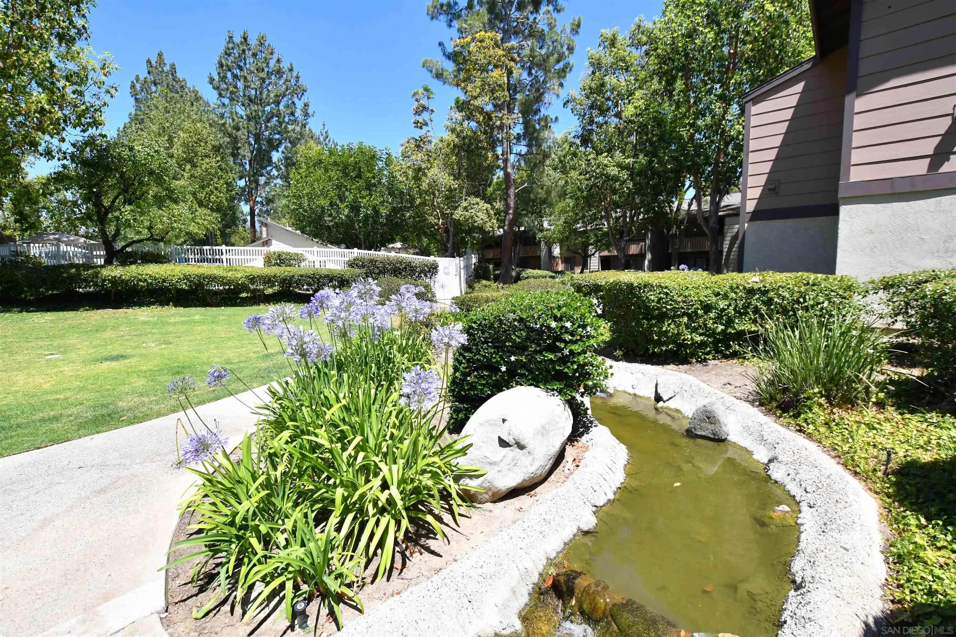 20702 El Toro Road, Unit 258 Lake Forest, CA 92630 - Photo 27 of 30 a view of a swimming pool with a yard