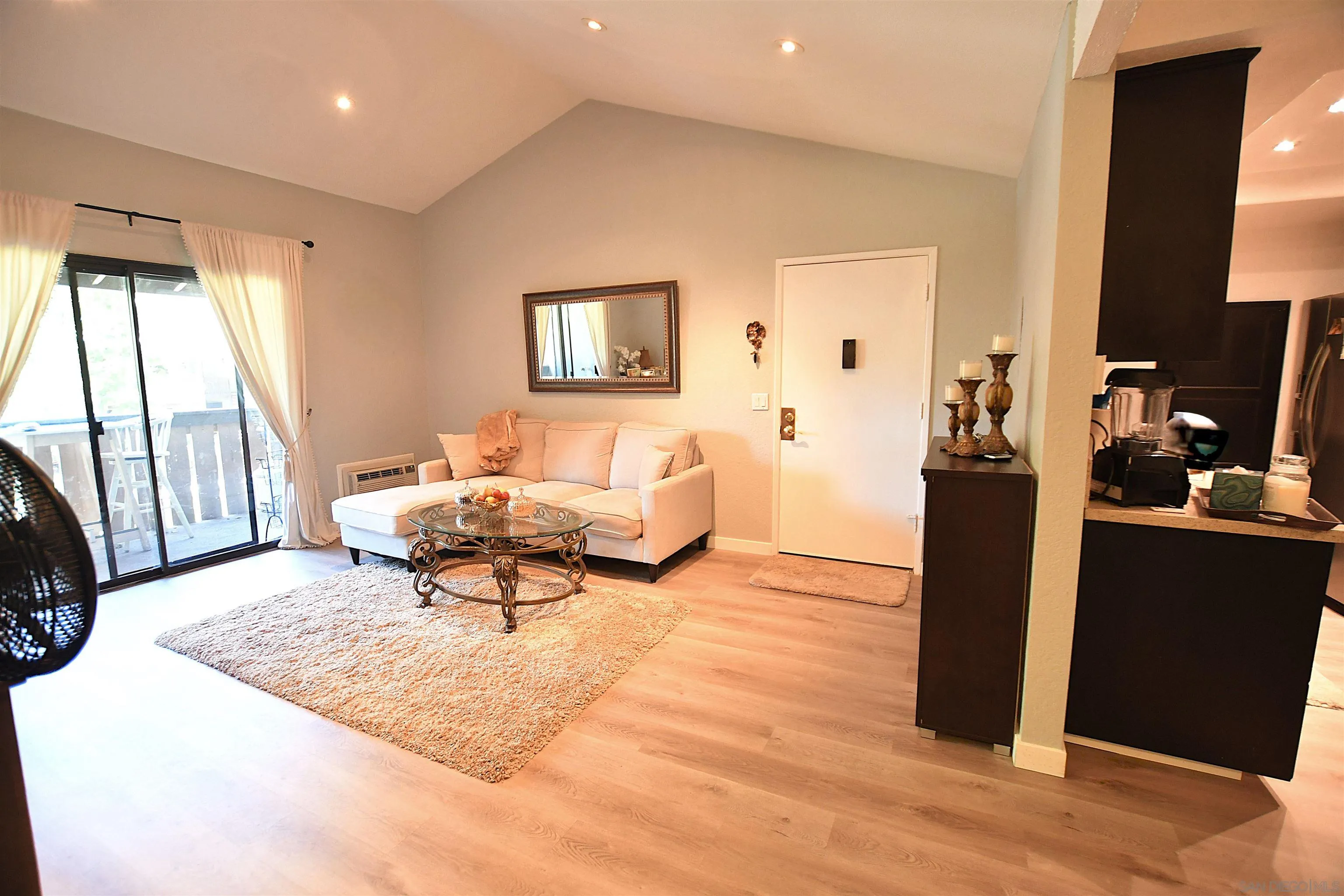 20702 El Toro Road, Unit 258 Lake Forest, CA 92630 - Photo 3 of 30 a living room with furniture and a table