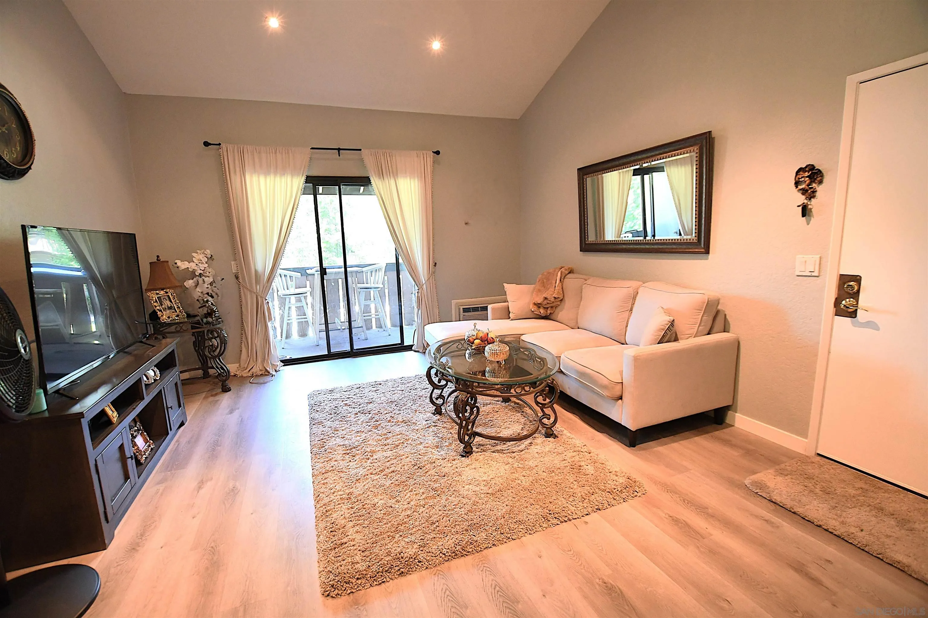 20702 El Toro Road, Unit 258 Lake Forest, CA 92630 - Photo 4 of 30 a living room with furniture and a flat screen tv