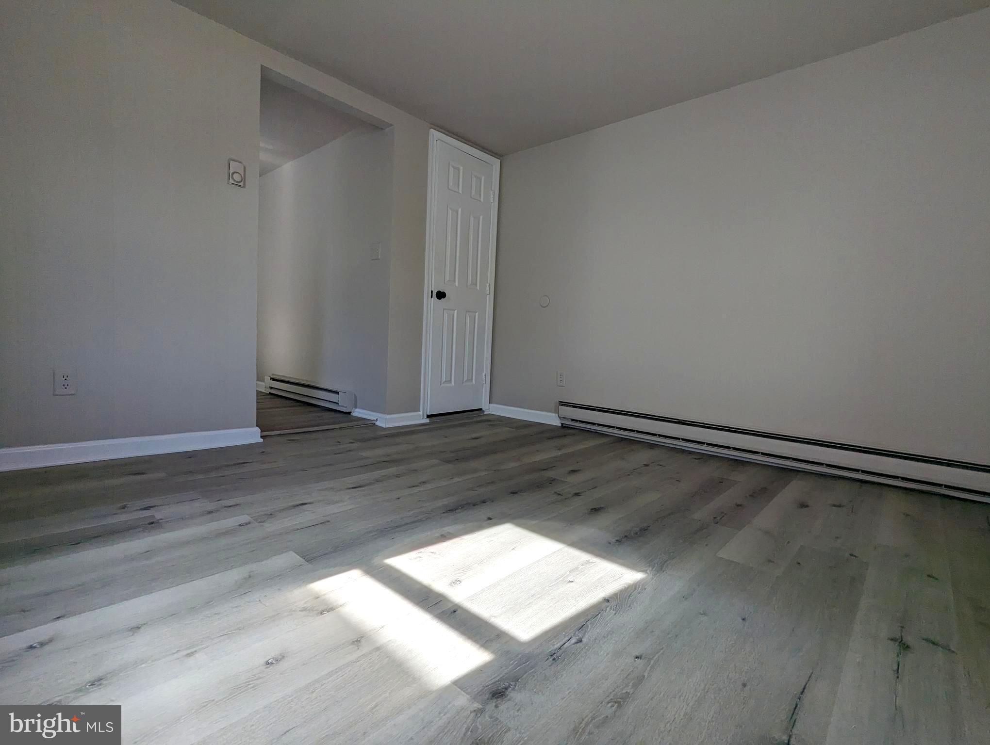 810 Washington Street Cambridge, MD 21613 - Photo 2 of 8 a view of a room with wooden floor