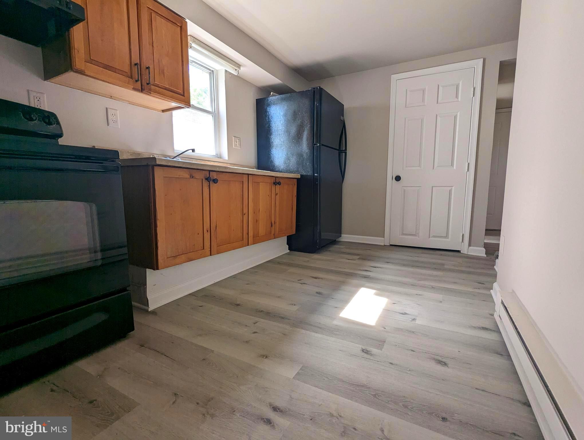 810 Washington Street Cambridge, MD 21613 - Photo 3 of 8 a view of empty room with wooden floor and cabinet