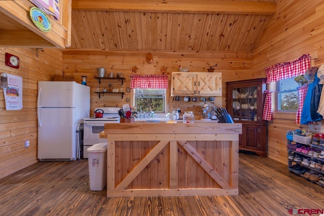 553 Cow Canyon Road Ignacio, CO 81137 - Photo 5 of 34 a view of a kitchen with fridge and wooden floor