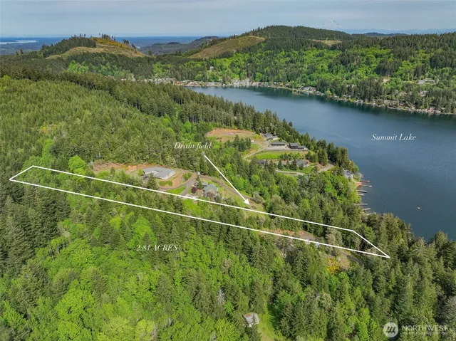 a view of a field with a lake