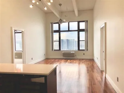 a view of an empty room with a window