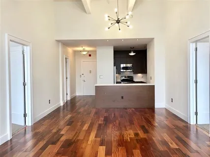 a view of kitchen with a sink a refrigerator and window