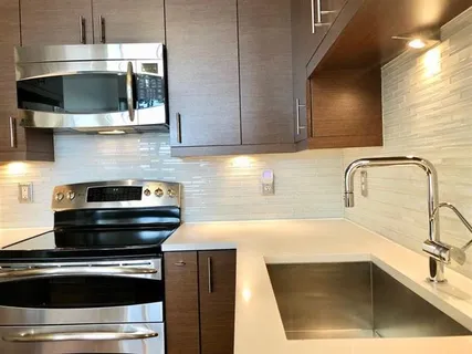 a kitchen with a sink and microwave