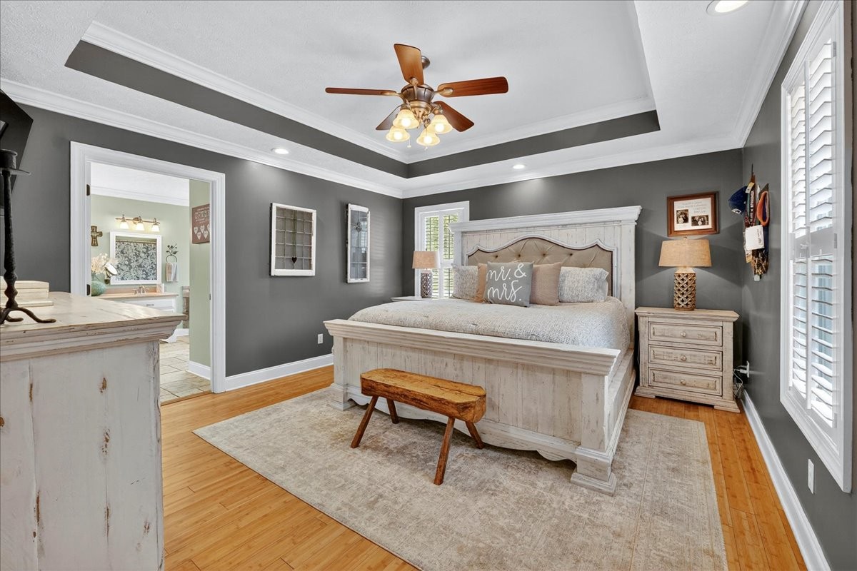 7225 Highway 57 Ramer, TN 38367 - Photo 18 of 68 a bedroom with a bed and wooden floor