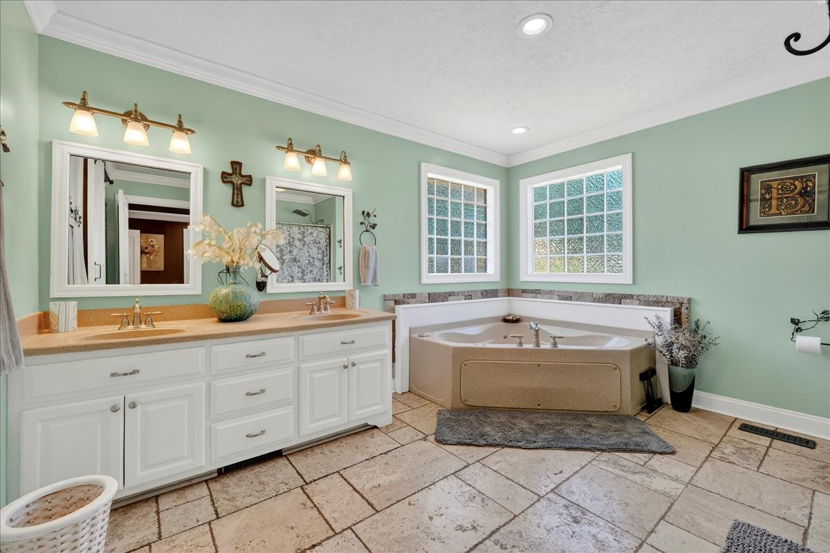 7225 Highway 57 Ramer, TN 38367 - Photo 19 of 68 a spacious bathroom with a tub sink and mirror