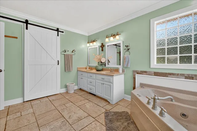 a bathroom with a toilet a sink and a large mirror