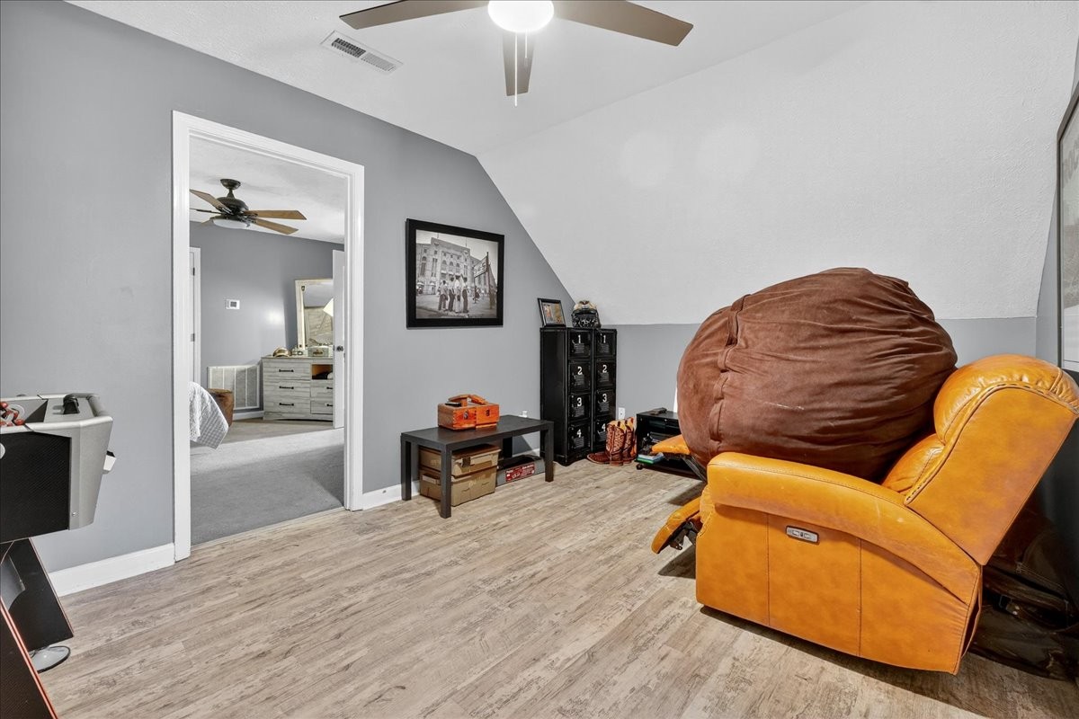 7225 Highway 57 Ramer, TN 38367 - Photo 29 of 68 a living room with furniture and a wooden floor