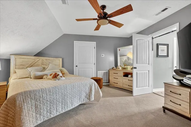 a view of a kitchen with a stove and wooden floor