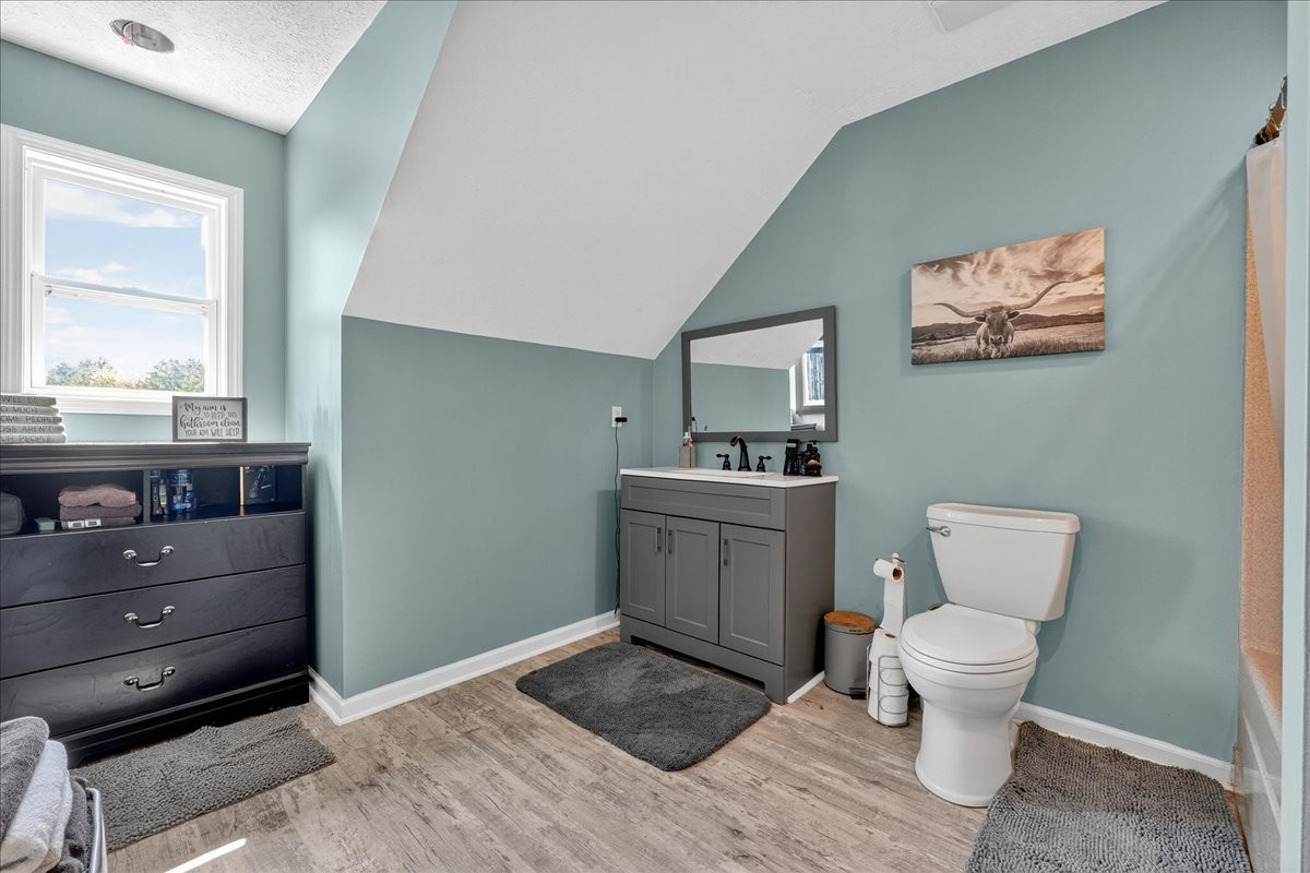 7225 Highway 57 Ramer, TN 38367 - Photo 33 of 68 a bathroom with a toilet sink and mirror