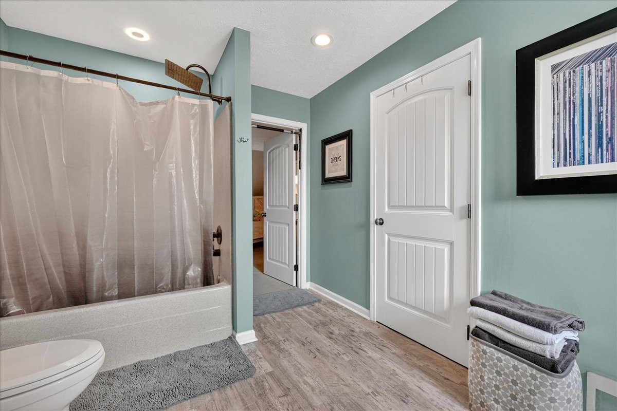 7225 Highway 57 Ramer, TN 38367 - Photo 34 of 68 a bathroom with a toilet a sink and shower