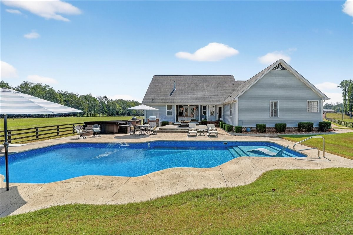 7225 Highway 57 Ramer, TN 38367 - Photo 42 of 68 a view of a house with pool and chairs