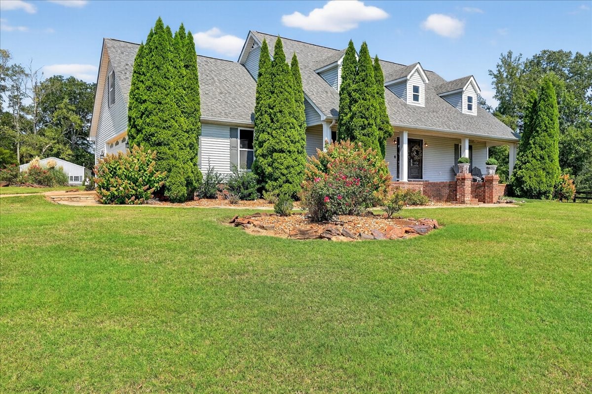 7225 Highway 57 Ramer, TN 38367 - Photo 6 of 68 a front view of a house with a yard