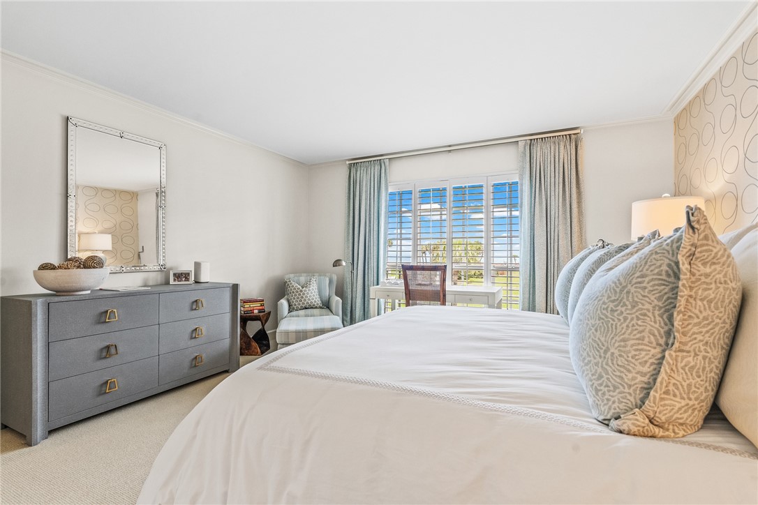 550 Beach Road, Unit 223 Vero Beach, FL 32963 - Photo 23 of 36 a spacious bedroom with a bed and a dresser