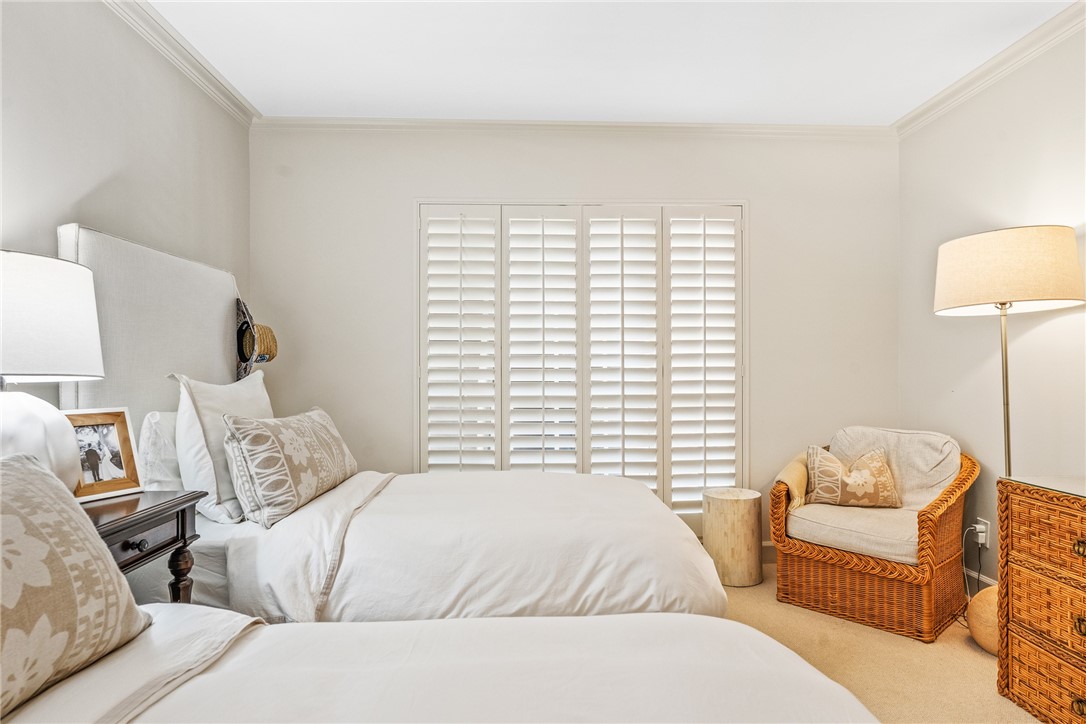 550 Beach Road, Unit 223 Vero Beach, FL 32963 - Photo 26 of 36 a bedroom with a bed and a lamp