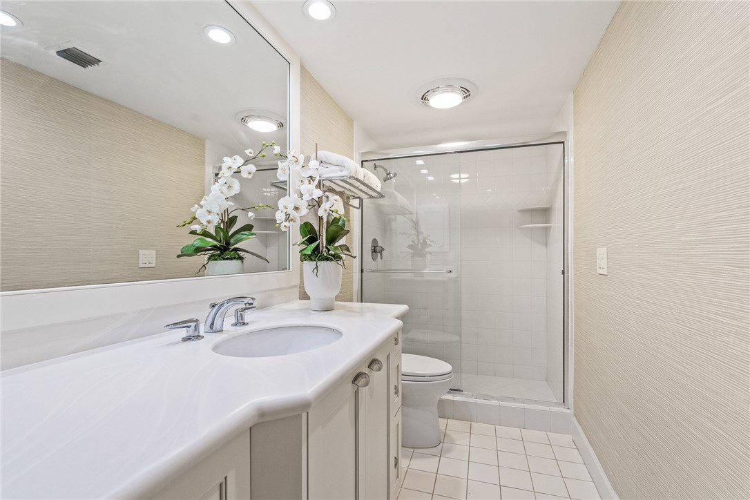 550 Beach Road, Unit 223 Vero Beach, FL 32963 - Photo 27 of 36 a bathroom with a sink toilet and shower