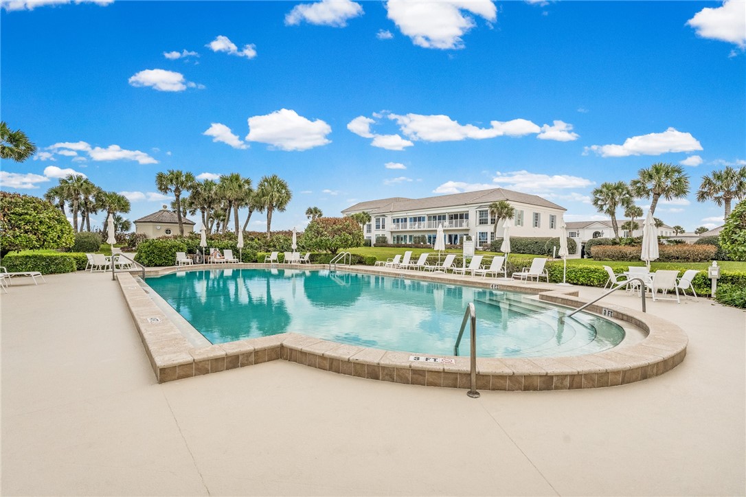 550 Beach Road, Unit 223 Vero Beach, FL 32963 - Photo 31 of 36 a view of a swimming pool with a lake view