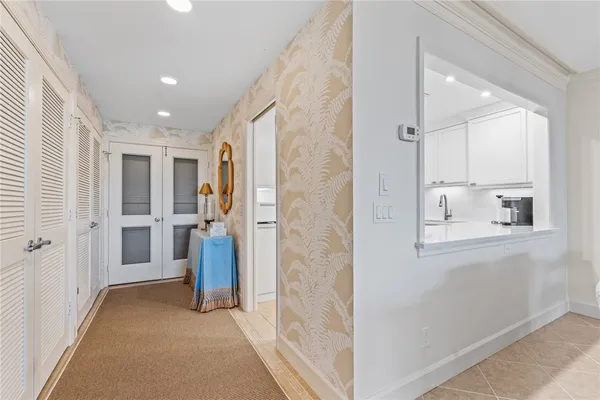a view of a hallway and dining room